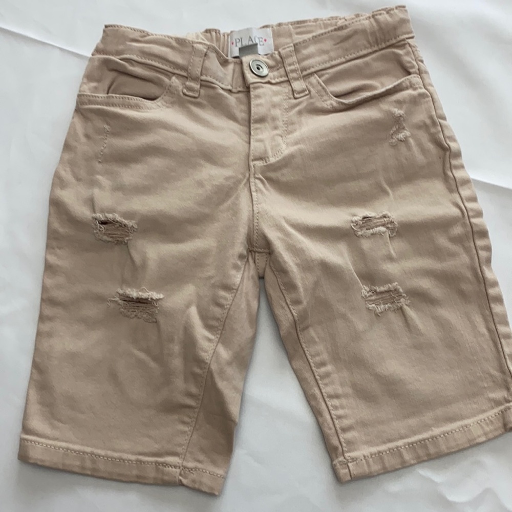 Little girls ripped blush colored shorts